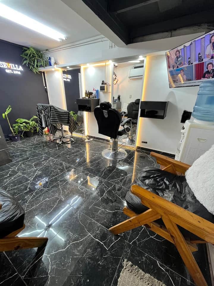 Sillón y espejos de Sevilla Barber Shop